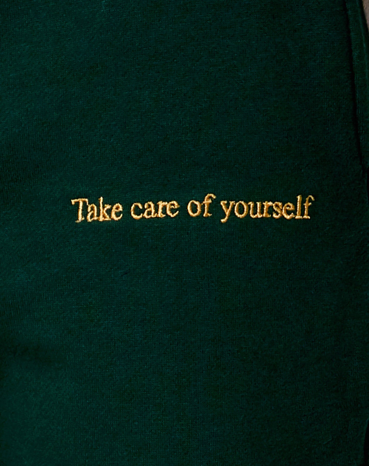 Basta Jogger in Bottle Green with 'Take Care Of Yourself' Embro